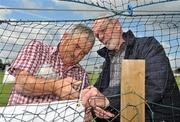 30 May 2010; Pat McManamon, from Co. Mayo, left, and Iggy Donnelly, from Co. Tyrone, affix signage behind the goals before the game. Connacht GAA Football Senior Championship Quarter-Final, London v Roscommon, Emerald Park, Ruislip, London, England. Picture credit: Diarmuid Greene / SPORTSFILE