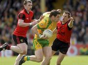 30 May 2010; Kevin Cassidy, Donegal, in action against Kalum King and Daniel Hughes, Down. Ulster GAA Football Senior Championship Quarter-Final, Donegal v Down, Mac Cumhail Park, Ballybofey, Co. Donegal. Picture credit: Oliver McVeigh / SPORTSFILE