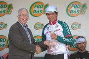 30 May 2010; Chirs Coyle, Mayo Castlebar Western Edge, is presented with the best county rider on the stage award by Race Director Dermot Dignam. FBD Insurance Ras, Stage 8, Kilcullen - Skerries. Picture credit: Stephen McCarthy / SPORTSFILE