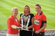 2 June 2010; At the launch of the Gala All-Ireland Camogie Championships 2010, from left, Joan O'Flynn, President, Cumann Camogaiochta na nGael, Denise Lord, Customer Service Manager, Gala, and Lisa McCrickard, Down, with the Premier Junior Cup. Camogie fans are set for a triple delight following the announcement at the launch that the Intermediate Camogie Final will be played with the Senior and Premier Junior Finals for the first time in GAA headquarters this year. Croke Park, Dublin. Picture credit: Brendan Moran / SPORTSFILE