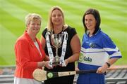2 June 2010; At the launch of the Gala All-Ireland Camogie Championships 2010, from left, Joan O'Flynn, President, Cumann Camogaiochta na nGael, Denise Lord, Customer Service Manager, Gala, and Aine Mahony, Laois, with the Premier Junior Cup. Camogie fans are set for a triple delight following the announcement at the launch that the Intermediate Camogie Final will be played with the Senior and Premier Junior Finals for the first time in GAA headquarters this year. Croke Park, Dublin. Picture credit: Brendan Moran / SPORTSFILE