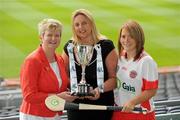 2 June 2010; At the launch of the Gala All-Ireland Camogie Championships 2010, from left, Joan O'Flynn, President, Cumann Camogaiochta na nGael, Denise Lord, Customer Service Manager, Gala, and Siobhan Hughes, Tyrone, with the Junior A Cup. Camogie fans are set for a triple delight following the announcement at the launch that the Intermediate Camogie Final will be played with the Senior and Premier Junior Finals for the first time in GAA headquarters this year. Croke Park, Dublin. Picture credit: Brendan Moran / SPORTSFILE