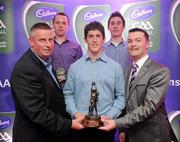 2 June 2010; Shane Guest, Senior Brand Manager, Cadbury Ireland, and 2010 Cadbury Hero of the Future judge and former Dublin manager Paul Caffrey with 2010 Cadbury Hero of the Future Award winner Rory O'Carroll, centre, and fellow Dublin footballers Dean Rock, left, and Nicky Devereux. Rory, Dean and Nicky were three of 14 shortlisted players who had excelled throughout the 2010 Cadbury GAA U21 Football Championship, all nominees can be seen on www.cadburygaau21.com Past winners include Colm O’Neill and Fintan Goold from Cork, Killian Young from Kerry and Keith Higgins from Mayo and all have gone on to represent their counties at senior level. Rory, who plays his club football with Kilmacud Crokes, was named as a Cadbury Hero of the Match for his performance against Donegal in the All Ireland Final. The judging panel which consisted of senior Kildare footballer Dermot Earley, former Dublin manager Paul Caffrey and TG4 journalist Michael O’Domhnaill, gave serious consideration to the public vote which saw over 5,000 votes cast on cadburygaau21.com, but ultimately Rory O’Carroll’s heroic performances in both the semi-final against Roscommon and the final against Donegal, where he faced two of the Ireland’s most talented footballers meant he edged the competition out in the end. Cadbury Under 21 Hero of the Future Awards, Croke Park, Dublin. Picture credit: Stephen McCarthy / SPORTSFILE