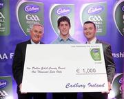 2 June 2010; Uachtarán Chumann Lúthchleas Gael Criostóir Ó Cuana and Shane Guest, Senior Brand Manager, Cadbury Ireland, presenting Dublin footballer Rory O'Carroll, 2010 Cadbury Hero of the Future Award Winner, with a €1,000 cheque for the Dublin GAA County Board, as part of his prize. Rory was one of 14 shortlisted players who had excelled throughout the 2010 Cadbury GAA U21 Football Championship, all nominees can be seen on www.cadburygaau21.com Past winners include Colm O’Neill and Fintan Goold from Cork, Killian Young from Kerry and Keith Higgins from Mayo and all have gone on to represent their counties at senior level. Rory, who plays his club football with Kilmacud Crokes, was named as a Cadbury Hero of the Match for his performance against Donegal in the All Ireland Final. The judging panel which consisted of senior Kildare footballer Dermot Earley, former Dublin manager Paul Caffrey and TG4 journalist Michael O’Domhnaill, gave serious consideration to the public vote which saw over 5,000 votes cast on cadburygaau21.com, but ultimately Rory O’Carroll’s heroic performances in both the semi-final against Roscommon and the final against Donegal, where he faced two of the Ireland’s most talented footballers meant he edged the competition out in the end. Cadbury Under 21 Hero of the Future Awards, Croke Park, Dublin. Picture credit: Stephen McCarthy / SPORTSFILE