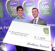 2 June 2010; Shane Guest, Senior Brand Manager, Cadbury Ireland, presenting Dublin footballer Rory O'Carroll, 2010 Cadbury Hero of the Future Award Winner, with a €1,000 cheque for the Dublin GAA County Board, as part of his prize. Rory was one of 14 shortlisted players who had excelled throughout the 2010 Cadbury GAA U21 Football Championship, all nominees can be seen on www.cadburygaau21.com Past winners include Colm O’Neill and Fintan Goold from Cork, Killian Young from Kerry and Keith Higgins from Mayo and all have gone on to represent their counties at senior level. Rory, who plays his club football with Kilmacud Crokes, was named as a Cadbury Hero of the Match for his performance against Donegal in the All Ireland Final. The judging panel which consisted of senior Kildare footballer Dermot Earley, former Dublin manager Paul Caffrey and TG4 journalist Michael O’Domhnaill, gave serious consideration to the public vote which saw over 5,000 votes cast on cadburygaau21.com, but ultimately Rory O’Carroll’s heroic performances in both the semi-final against Roscommon and the final against Donegal, where he faced two of the Ireland’s most talented footballers meant he edged the competition out in the end. Cadbury Under 21 Hero of the Future Awards, Croke Park, Dublin. Picture credit: Stephen McCarthy / SPORTSFILE