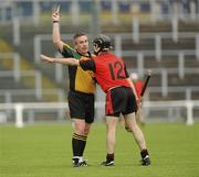 29 May 2010; Ciaran Coulter, Down, remonstrates with referee Garrett Duffy as he receives a yellow card. Ulster GAA Hurling Senior Championship Quarter-Final, Down v Armagh, Casement Park, Belfast. Picture credit: Oliver McVeigh / SPORTSFILE