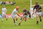 5 June 2010; Adrian McAndrew, Kildare, in action against Greg Gavin, centre, and Darren McCormack, Westmeath. Christy Ring Cup Semi-Final, Kildare v Westmeath, Pairc Tailteann, Navan, Co. Meath. Picture credit: Barry Cregg / SPORTSFILE