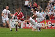 5 June 2010; Paddy Keenan, Louth, in action against James Kavanagh, left, Daryl Flynn and David Whyte, right, Kildare. Leinster GAA Football Senior Championship Quarter-Final, Louth v Kildare, Pairc Tailteann, Navan, Co. Meath. Photo by Sportsfile