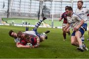 8 May 2016; Anthony Ryan, Clontarf, goes over to score his side's third try, dispite the attention from Cork Constitution players Conor Kindregan and James Murphy. Ulster Bank League, Division 1A, Final, Clontarf v Cork Constitution. Aviva Stadium, Lansdowne Road, Dublin. Picture credit: David Maher / SPORTSFILE