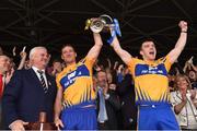 8 May 2016; Uachtarán Chumann Lúthchleas Gael Aogán Ó Fearghail presents the cup to joint Clare captains Cian Dillon, left, and Tony Kelly after the Allianz Hurling League, Division 1 Final - Replay, Clare v Waterford at Semple Stadium, Thurles, Tipperary. Picture credit: Ray McManus / SPORTSFILE