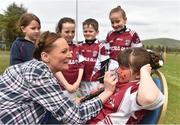 8 May 2016; Facepainter Kelly O'Sullivan, paints the face of her daughter, Jennie O'Sullivan, aged 7, under the supervision of Chloe Lenihan, aged 8, Sadbh Geary, aged 8, Oisin Devereux, aged 7, and Aoibhin Devereux, aged 8, during the Piarsaigh Na Dromoda Lá na gClubanna celebrations. Lá Na gClubanna - Piarsaigh Na Dromoda. Páirc an Phiarsaigh, Inse na Toinne, Dromid, Co. Kerry. Picture credit: Diarmuid Greene / SPORTSFILE