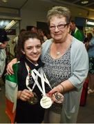 8 May 2016; Nicole Turner, from Portarlington, Co. Laois, who won two silver medals and one bronze medal, and also secured nine personal best times over the course of the seven-day competition, is greeted by her grandmother Jenny on her return to Dublin Airport from the IPC European Open Swim Championships in Funchal, Portugal. The squad collected two European silver medals, one bronze medal and a whopping 23 Personal Best times. Picture credit: Stephen McCarthy / SPORTSFILE