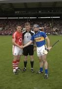 30 May 2010; Referee Barry Kelly with to both the Cork, Kieran Murphy, and Tipperary, Eoin Kelly, captains before the game. Munster GAA Hurling Senior Championship Quarter-Final, Cork v Tipperary, Pairc Ui Chaoimh, Cork. Picture credit: Ray McManus / SPORTSFILE