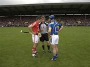 30 May 2010; Referee Barry Kelly speaks to both the Cork, Kieran Murphy, and Tipperary, Eoin Kelly, captains before the game. Munster GAA Hurling Senior Championship Quarter-Final, Cork v Tipperary, Pairc Ui Chaoimh, Cork. Picture credit: Ray McManus / SPORTSFILE