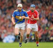 30 May 2010; Brendan Maher, Tipperary, in action against Tom Kenny, Cork. Munster GAA Hurling Senior Championship Quarter-Final, Cork v Tipperary, Pairc Ui Chaoimh, Cork. Picture credit: Ray McManus / SPORTSFILE