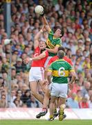 6 June 2010; Anthony Maher, Kerry, gets his hand to the ball ahead of Alan O'Connor, Cork. Munster GAA Football Senior Championship Semi-Final, Kerry v Cork, Fitzgerald Stadium, Killarney, Co. Kerry. Picture credit: Brendan Moran / SPORTSFILE