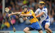 7 June 2010; Patrick Donnellan, Clare, races clear of Maurice Shanahan, Waterford. Munster GAA Hurling Senior Championship Semi-Final, Waterford v Clare, Semple Stadium, Thurles, Co. Tipperary. Picture credit: Brendan Moran / SPORTSFILE