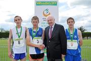 5 June 2010; Stephen Attride, Knockbeg College, Carlow, in the company of 3rd placed Andrew Monaghan, St Colman's, Newry, Co. Down, right, and 2nd placed, Ryan Holt, Newtownbreda High School, Co. Antrim, is congratulated by Ray Colman, CEO, Woodie's DIY, after winning the Intermediate Boys 3000m during the Woodie’s DIY Irish Schools’ Track and Field Championship. Tullamore Harriers Stadium, Tullamore, Co. Offaly. Picture credit: Brendan Moran / SPORTSFILE