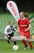 11 May 2016; Emer McCarthy, Thomastown NS, Tipperary, in action against Catherine Hanley, St Joseph's NS, Woodford, Galway. SPAR FAI Primary School 5s National Finals, Aviva Stadium, Dublin. Picture credit: Piaras Ó Mídheach / SPORTSFILE