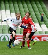 11 May 2016; Catherine Hanley, St Joseph's NS, Woodford, Galway, in action against Kate Flannery, Thomastown NS, Tipperary. SPAR FAI Primary School 5s National Finals, Aviva Stadium, Dublin. Picture credit: Piaras Ó Mídheach / SPORTSFILE
