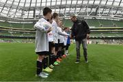 11 May 2016; SPAR FAI Primary School 5s Programme ambassador and former Republic of Ireland International Jason McAteer was at the AVIVA Stadium to watch the SPAR FAI Primary School 5s National Finals where 192 girls and boys from 24 schools battled it out for national honours. The 2016 SPAR FAI Primary School 5s Programme was the biggest yet as almost 24,000 children from 1,267 schools took part in county, regional and provincial blitzes nationwide. For further information please see www.spar.ie or www.faischools.ie Pictured was Jason McAteer shakes hands with pupils from Carns NS, Co. Sligo. Aviva Stadium, Dublin. Picture credit: Matt Browne / SPORTSFILE