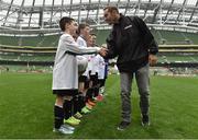 11 May 2016; SPAR FAI Primary School 5s Programme ambassador and former Republic of Ireland International Jason McAteer was at the AVIVA Stadium to watch the SPAR FAI Primary School 5s National Finals where 192 girls and boys from 24 schools battled it out for national honours. The 2016 SPAR FAI Primary School 5s Programme was the biggest yet as almost 24,000 children from 1,267 schools took part in county, regional and provincial blitzes nationwide. For further information please see www.spar.ie or www.faischools.ie Pictured was Jason McAteer who shakes hands with 10 year old Conor Walsh while he was meating pupils from Carns NS, Co. Sligo. Aviva Stadium, Dublin. Picture credit: Matt Browne / SPORTSFILE
