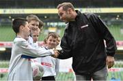 11 May 2016; SPAR FAI Primary School 5s Programme ambassador and former Republic of Ireland International Jason McAteer was at the AVIVA Stadium to watch the SPAR FAI Primary School 5s National Finals where 192 girls and boys from 24 schools battled it out for national honours. The 2016 SPAR FAI Primary School 5s Programme was the biggest yet as almost 24,000 children from 1,267 schools took part in county, regional and provincial blitzes nationwide. For further information please see www.spar.ie or www.faischools.ie Pictured was Jason McAteer who shakes hands with 10 year old Conor Walsh while he was meating pupils from Carns NS, Co. Sligo. Aviva Stadium, Dublin. Picture credit: Matt Browne / SPORTSFILE