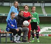 11 May 2016; SPAR FAI Primary School 5s Programme ambassador and former Republic of Ireland International Jason McAteer was at the AVIVA Stadium to watch the SPAR FAI Primary School 5s National Finals where 192 girls and boys from 24 schools battled it out for national honours. The 2016 SPAR FAI Primary School 5s Programme was the biggest yet as almost 24,000 children from 1,267 schools took part in county, regional and provincial blitzes nationwide. For further information please see www.spar.ie or www.faischools.ie Pictured was Jason McAteer with some of the children who took part, from left, Jamie McCoy, from Carns, NS, Gurteen, Co. Sligo, Bea Drummond, from Ardnagrath, NS, Athlone, Co. Westmeath, Cian Fitzgerald, from Croom, NS, Co. Limerick, and Bonnie McKiernan, from Scoil Mhuire, Lacken, Co. Cavan. Aviva Stadium, Dublin. Picture credit: Matt Browne / SPORTSFILE