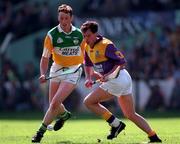 14 June 1998; Adrian Fenlon of Wexford in action against John Ryan of Offaly during the Leinster Senior Hurling Championship Semi-Final match between Offaly and Wexford at Croke Park in Dublin. Photo by Ray McManus/Sportsfile