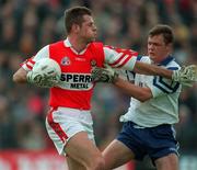 31 May 1998; Anthony Tohill of Derry in action against Cyril Ronaghan of Monaghan during the Ulster GAA Football Senior Championship Quarter-Final match between Derry and Monaghan at Celtic Park in Derry. Photo by David Maher/Sportsfile