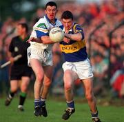 30 May 1998; Brendan Cummins of Tipperary is tackled by George Walsh of Waterford during the Munster Senior Football Championship Second Round match between Tipperary and Waterford at Ned Hall Park in Clonmel. Photo by Ray McManus/Sportsfile
