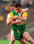 24 May 1998; Damien Diver of Donegal is held by Paul McErlean of Antrim during the Ulster Senior Football Championship Quarter-Final match between Antrim and Donegal at Casement Park in Belfast. Photo by David Maher/Sportsfile