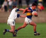 30 May 1998; Declan Browne of Tipperary is tackled by Jason Crotty of Waterford during the Munster Senior Football Championship Second Round match between Tipperary and Waterford at Ned Hall Park in Clonmel. Photo by Ray McManus/Sportsfile