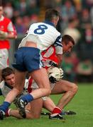 31 May 1998; Eamonn Burns of Derry in action against Gerard McGuirk of Monaghan during the Ulster GAA Football Senior Championship Quarter-Final match between Derry and Monaghan at Celtic Park in Derry. Photo by David Maher/Sportsfile