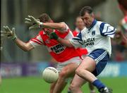 31 May 1998; Anthony Tohill of Derry attempts to block Gerard McGuirk of Monaghan during the Ulster GAA Football Senior Championship Quarter-Final match between Derry and Monaghan at Celtic Park in Derry. Photo by David Maher/Sportsfile