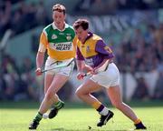 14 June 1998; Adrian Fenlon of Wexford in action against John Ryan of Offaly. Offaly v Wexford, Leinster Hurling Championship, Croke Park. Picture Credit: Ray McManus/SPORTSFILE.