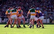 14 June 1998. Johnny Dooley, Offaly, extreme left watches his shot on the way to the Wexford net for what proved to be the winning goal .  Offaly V Wexford, Leinster Hurling Championship, Croke Park, Dublin. Picture Credit: Ray McManus/SPORTSFILE.