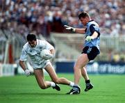26 July 1992. Kildare's Martin Lynch holds possession despite the attention of Dublin's Charlie Redmond. Dublin v Kildare, Leinster Football Final, Croke Park. Picture Credit: Ray McManus/SPORTSFILE.