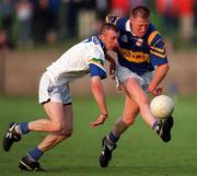 30 May 1998; Michael Spillane of Tipperary is tackled by Matty Kiely of Waterford during the Munster Senior Football Championship Second Round match between Tipperary and Waterford at Ned Hall Park in Clonmel. Photo by Ray McManus/Sportsfile