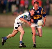 30 May 1998; Michael Spillane of Tipperary is tackled by Matty Kiely of Waterford during the Munster Senior Football Championship Second Round match between Tipperary and Waterford at Ned Hall Park in Clonmel. Photo by Ray McManus/Sportsfile