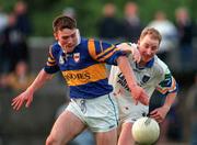 30 May 1998; Niall Kelly of Tipperary is tackled by Oliver Costelloe of Waterford during the Munster Senior Football Championship Second Round match between Tipperary and Waterford at Ned Hall Park in Clonmel. Photo by Ray McManus/Sportsfile