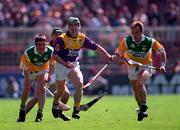 14 June 1998; Robert Hassey of Wexford in action against Joe Dooley of Offaly during the Leinster Senior Hurling Championship Semi-Final match between Offaly and Wexford at Croke Park in Dublin. Photo by Ray McManus/Sportsfile