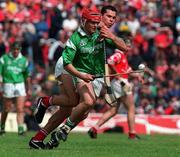 31 May 1998; TJ Tyan of Limerick is tackled by SeÃ¡n Og O hAilpin Cork during the Munster Senior Hurling Championship Quarter-Final match between Limerick and Cork at the Gaelic Grounds in Limerick. Photo by Ray McManus/Sportsfile