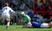 10 June 2001; James Butler of Limerick has a shot on goal despite the attempts of Brian Flannery of Waterford, left, and Waterford goalkeeper Brendan Landers during the Guinness Munster Senior Hurling Championship Semi-Final match between Limerick and Waterford at Páirc Uí Chaoimh in Cork. Photo by Brendan Moran/Sportsfile