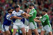 10 June 2001; Sean Cullinane of Waterford tussles with Brian Begley of Limerick during the Guinness Munster Senior Hurling Championship Semi-Final match between Limerick and Waterford at Páirc Uí Chaoimh in Cork. Photo by Brendan Moran/Sportsfile