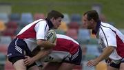 11 June 2001; Brian O'Driscoll, left, is tackled by Marin Corry and Richard Hill, right, during a British and Irish Lions Training Session at Dairy Farmers Stadium in Townsville in Queensland, Australia. Photo by Matt Browne/Sportsfile