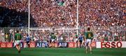 6 July 1991; Kevin Foley of Meath shoots to score a goal late in the game as Dublin supporters on Hill 16 look on during the Leinster Senior Football Championship Preliminary Round Third Replay match between Dublin and Meath at Croke Park in Dublin. Photo by Ray McManus/Sportsfile