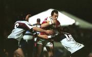 16 June 2001; Rob Howley of British and Irish Lions is tackled by Sam Cordingley, left, and Michael Tabrett of Queensland Reds during the match between Queenslands Reds and British and Irish Lions at Ballymore in Queensland, Australia. Photo by Matt Browne/Sportsfile