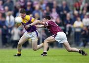 16 June 2001; David Murphy of Wexford clears under pressure from Joe Fallon of Westmeath during the Bank of Ireland All-Ireland Senior Football Championship Qualifier Round 1 Replay match between Westmeath and Wexford at Cusack Park in Mullingar, Westmeath. Photo by Ray McManus/Sportsfile