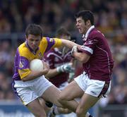 16 June 2001; Diarmuid Kinsella of Wexford in action against Brian Morley of Westmeath during the Bank of Ireland All-Ireland Senior Football Championship Qualifier Round 1 Replay match between Westmeath and Wexford at Cusack Park in Mullingar, Westmeath. Photo by Ray McManus/Sportsfile